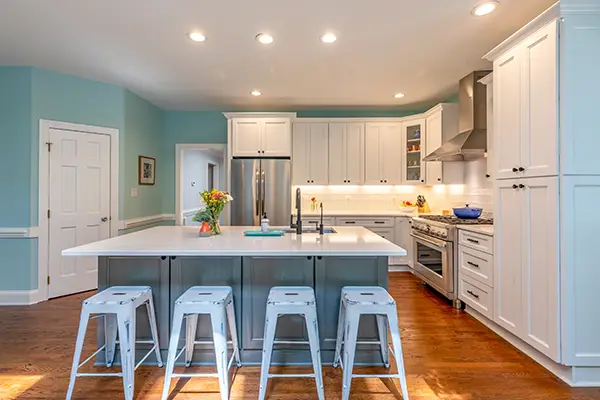 Bright and modern kitchen remodel featuring a spacious island and sleek white cabinetry, crafted by a trusted local kitchen remodeling company in Raleigh, North Carolina. Perfect for creating your dream kitchen in the heart of Raleigh!